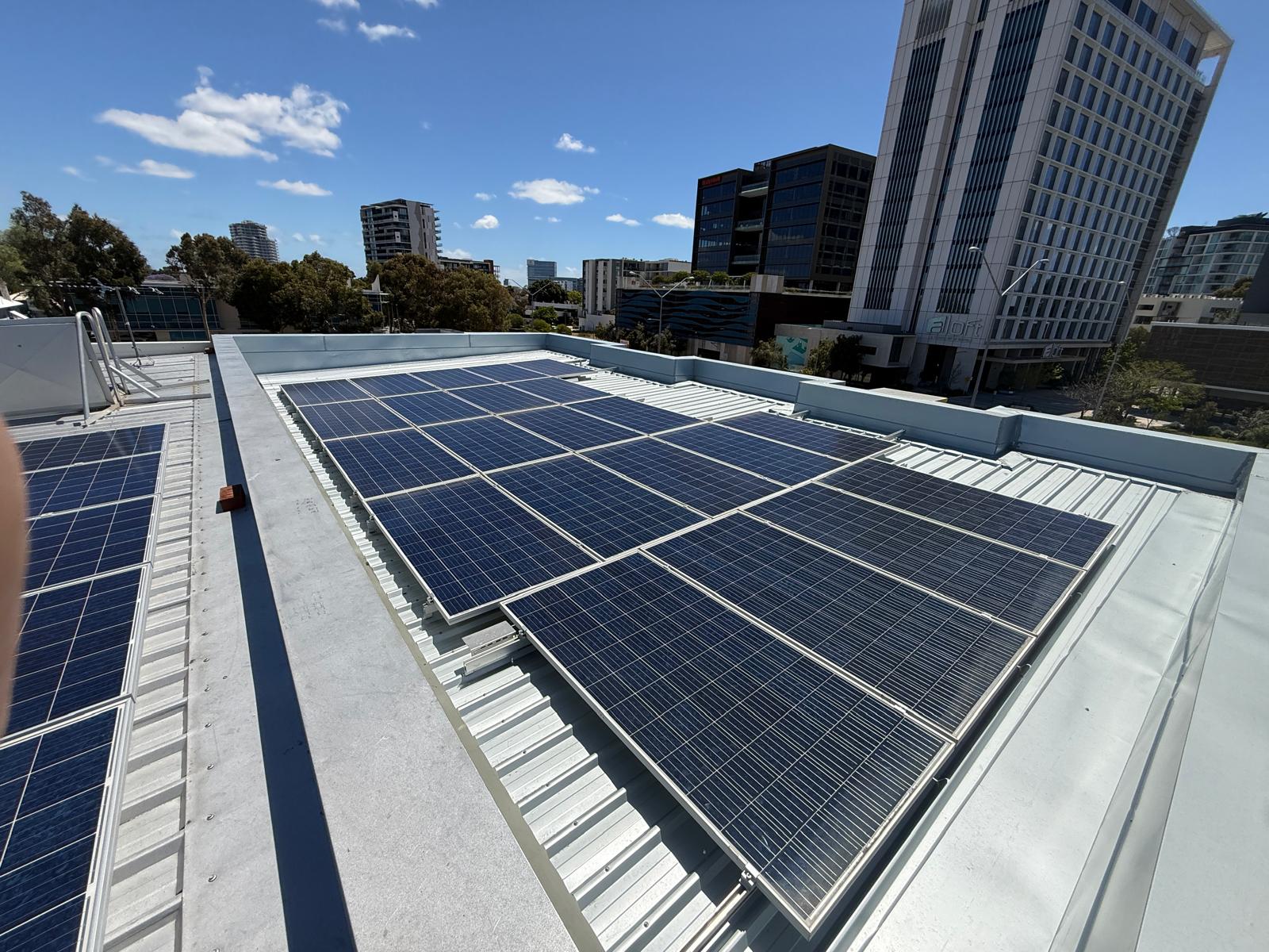 Commercial flat roof in Perth CBD with solar array, edge flashings and parapet
